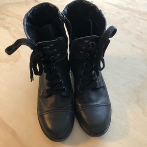 Black boots by Mark Fisher